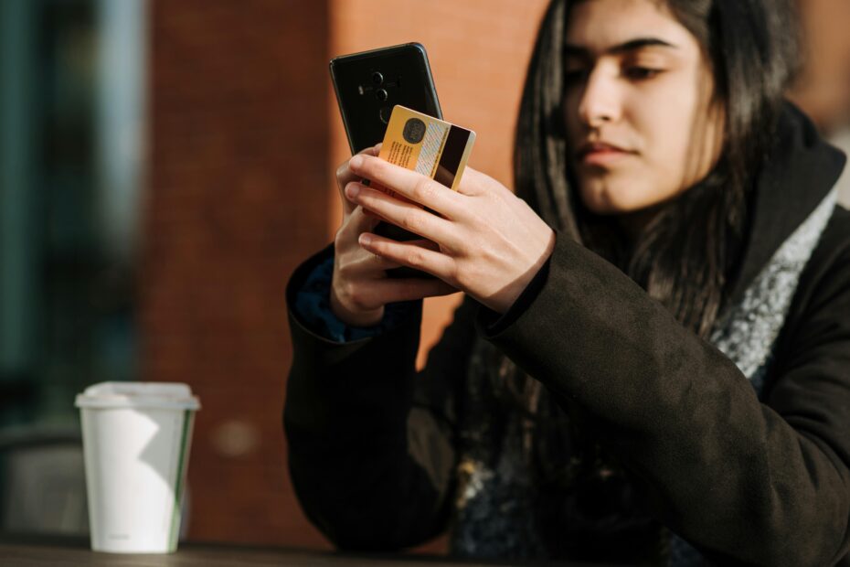 A lady confirming an online payment on her phone.